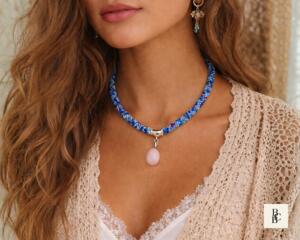 Lifestyle image of Bead & Braid Collective blue Kumihimo necklace with rose quartz pendant, handmade statement jewelry
